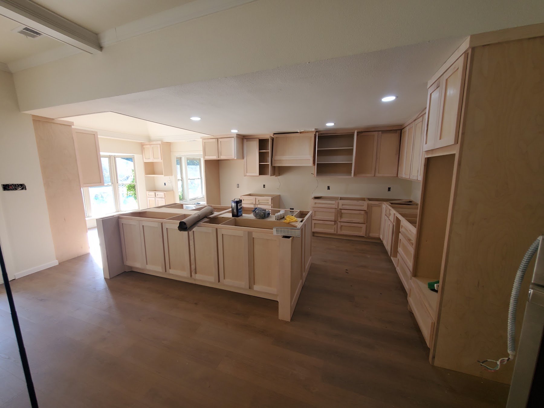 Bright kitchen renovation with new cabinets and flooring