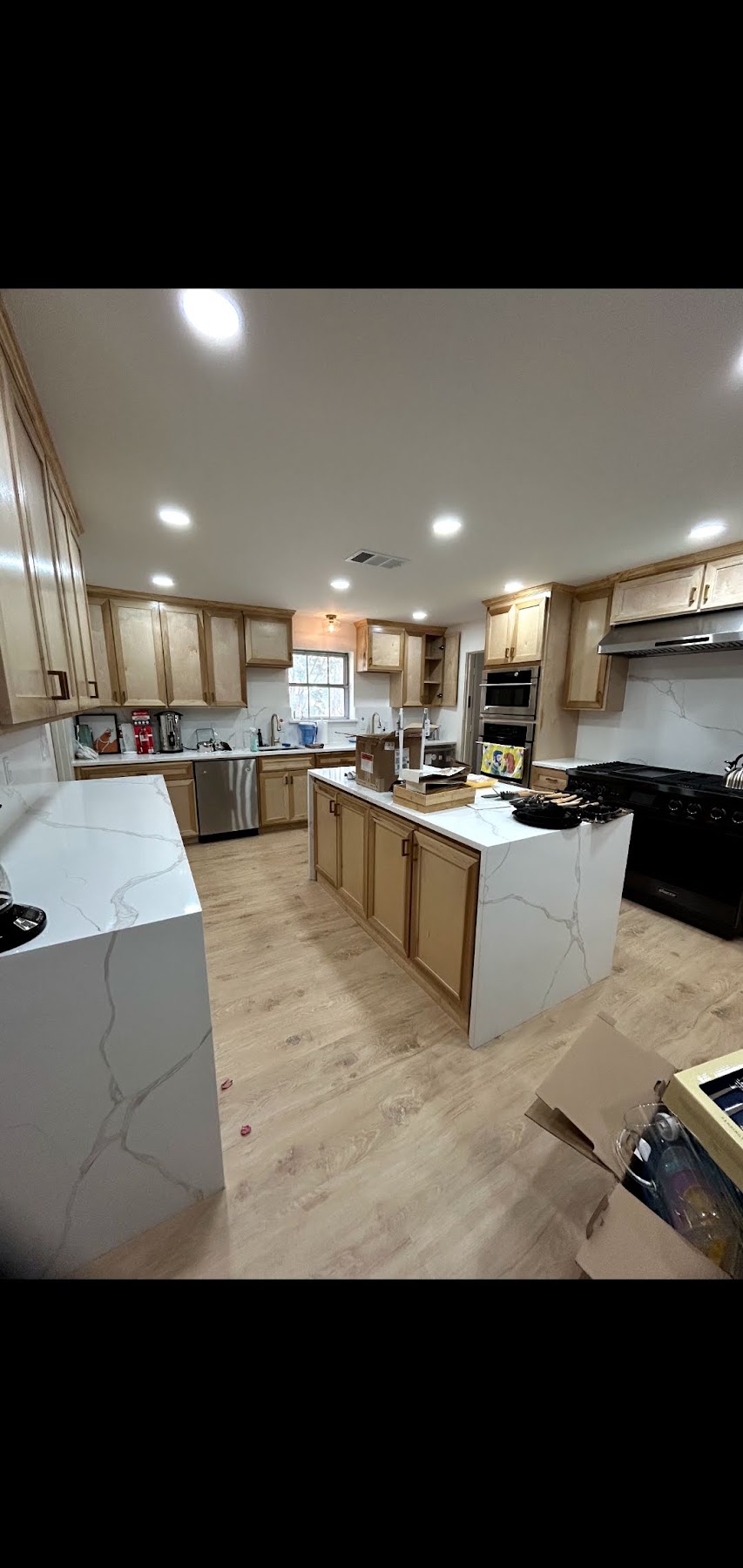 Kitchen renovation in progress with new cabinets and island
