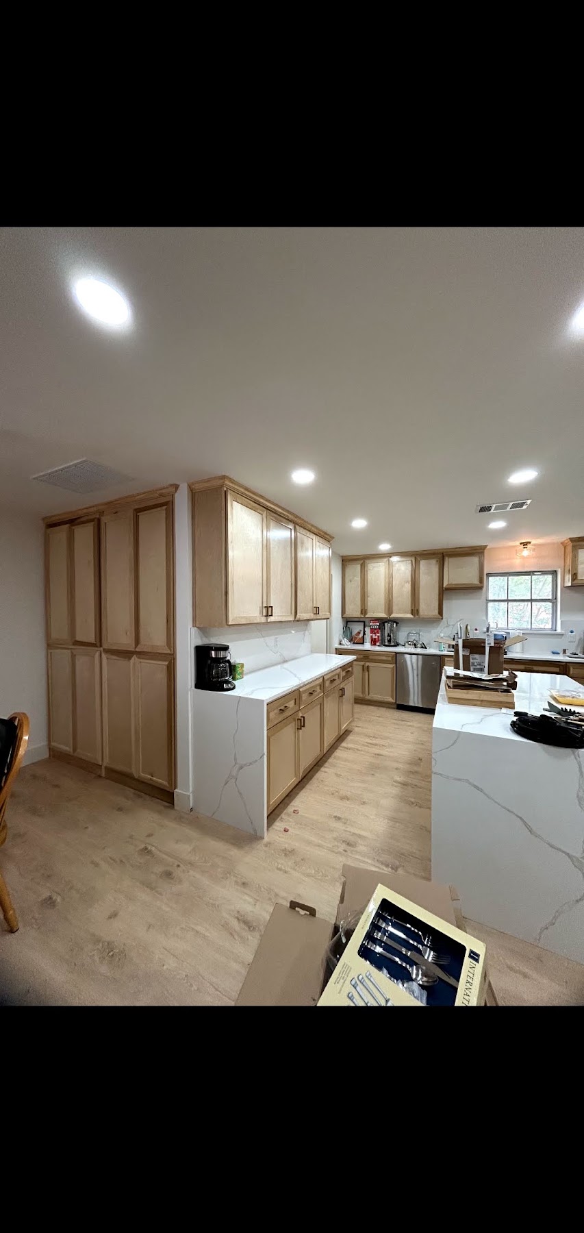 Kitchen cabinetry and island during a renovation