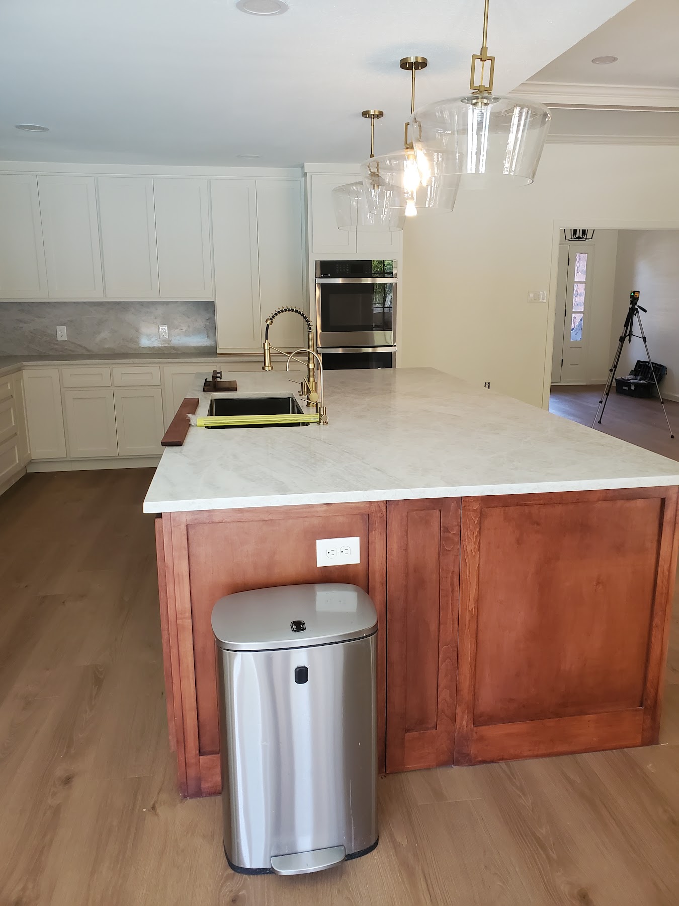 Completed white kitchen island and cabinetry